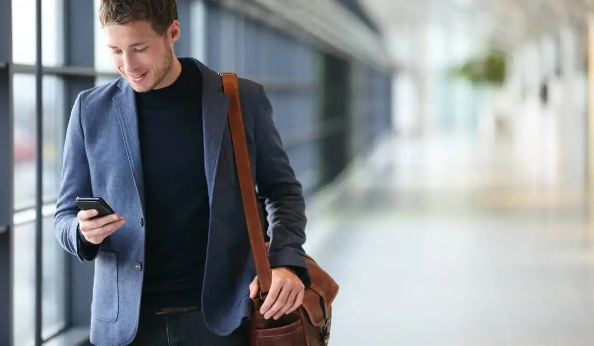 man and phone airport 